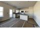 Unfinished kitchen with white cabinets, an island, and stainless steel appliances at 162 Deodora Ln, Cameron, NC 28326