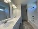 Well-lit bathroom featuring double vanity, a soaking tub and a separate shower at 180 Deodora Ln, Cameron, NC 28326