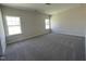 Spacious bedroom with plush carpeting and large windows offering plenty of natural light at 180 Deodora Ln, Cameron, NC 28326