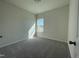 This is a bedroom with a window and neutral carpeting, perfect for personalization at 180 Deodora Ln, Cameron, NC 28326