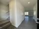 Inviting entryway features wood-look flooring and staircase leading to the upper level at 180 Deodora Ln, Cameron, NC 28326