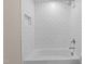 Beautiful bathroom featuring white subway tile surround and shower niche at 418 S Cross St, Youngsville, NC 27596