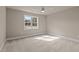 Inviting bedroom with plush carpet and lots of natural light at 418 S Cross St, Youngsville, NC 27596