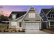 Charming home featuring a two-car garage and inviting craftsman-style design at 418 S Cross St, Youngsville, NC 27596