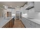 Modern kitchen with ample counter space, updated appliances, and stylish pendant lighting at 418 S Cross St, Youngsville, NC 27596