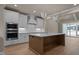 Well-appointed kitchen featuring a center island, stainless steel appliances, and an open layout at 418 S Cross St, Youngsville, NC 27596
