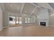 Bright, open living room featuring hardwood floors, a fireplace, and lots of natural light at 418 S Cross St, Youngsville, NC 27596