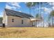 Stunning back exterior with a covered patio, neutral siding, and manicured landscaping, ideal for outdoor living at 50 N Rowsham Pl, Smithfield, NC 27577
