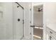 Bathroom features a stylish subway tile shower with black trim and door to bedroom at 50 N Rowsham Pl, Smithfield, NC 27577