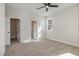 Bright bedroom with plush carpeting, neutral walls, large windows, and walk-in closet at 50 N Rowsham Pl, Smithfield, NC 27577
