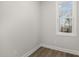 Small bedroom featuring a bright window, plank floors, and neutral paint at 50 N Rowsham Pl, Smithfield, NC 27577