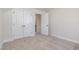 Neutral bedroom features carpet, a pair of double door closets, and trim work at 50 N Rowsham Pl, Smithfield, NC 27577