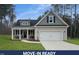 Charming home featuring a manicured lawn, two-car garage and a welcoming front porch at 50 N Rowsham Pl, Smithfield, NC 27577