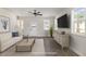 Staged living room boasts modern decor, neutral colors, and plenty of natural light at 50 N Rowsham Pl, Smithfield, NC 27577