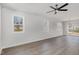 Bright, open living area features neutral walls, wood-look flooring, and ample natural light at 50 N Rowsham Pl, Smithfield, NC 27577
