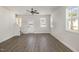 Unfurnished living room with ample natural light and modern wood-look flooring throughout at 50 N Rowsham Pl, Smithfield, NC 27577