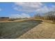 Expansive backyard with newly laid sod under a partly cloudy sky, ready for landscaping at 611 Highview Dr, Benson, NC 27504