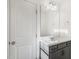 Well-lit bathroom with vanity, stylish mirror and convenient towel ring at 611 Highview Dr, Benson, NC 27504