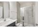 Modern bathroom with glass shower and neutral tones at 611 Highview Dr, Benson, NC 27504