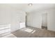 Sunny bedroom with double closet and open doorway at 611 Highview Dr, Benson, NC 27504