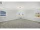 Large, naturally lit bedroom with plush carpet and multiple windows offering scenic views at 611 Highview Dr, Benson, NC 27504
