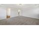 Spacious bedroom with neutral carpet and access to a hallway, showcasing a modern layout at 611 Highview Dr, Benson, NC 27504