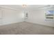 Bright bedroom with neutral carpet, recessed lighting, and a window that lets in natural light at 611 Highview Dr, Benson, NC 27504