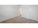 Bedroom features neutral carpet, white walls, and closet at 611 Highview Dr, Benson, NC 27504