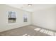 Comfortable bedroom featuring plush carpet and two windows with blinds at 611 Highview Dr, Benson, NC 27504