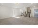 Bright bonus room with neutral carpet and staircase leading to another level at 611 Highview Dr, Benson, NC 27504