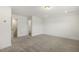 Carpeted bonus room with recessed lighting and access to the upstairs of the home at 611 Highview Dr, Benson, NC 27504