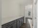 Butler's pantry boasts quartz countertops and gray cabinetry with sleek, black hardware at 611 Highview Dr, Benson, NC 27504