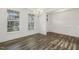 Bright dining space features hardwood floors, wainscoting, and large windows at 611 Highview Dr, Benson, NC 27504