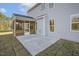 The rear exterior of the home, featuring a screened porch and gray siding at 611 Highview Dr, Benson, NC 27504
