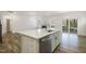 Open kitchen featuring large island, quartz countertops, a stainless dishwasher and spacious layout at 611 Highview Dr, Benson, NC 27504