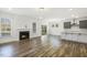 Open concept living space featuring fireplace and kitchen area at 611 Highview Dr, Benson, NC 27504