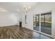 Living room featuring a fireplace, sliding doors to the screened porch, and wood-look flooring at 611 Highview Dr, Benson, NC 27504