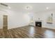 Bright living room featuring a fireplace and large windows at 611 Highview Dr, Benson, NC 27504