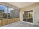 Covered screened porch with a concrete floor and views of the backyard at 611 Highview Dr, Benson, NC 27504