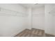Walk-in closet with wire shelving, neutral carpet, and ample storage space at 611 Highview Dr, Benson, NC 27504
