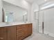 Bathroom featuring double sink vanity and shower with glass door and bench at 810 Barlow Dr, Knightdale, NC 27545