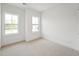 Bedroom with white walls, carpet and large windows at 810 Barlow Dr, Knightdale, NC 27545