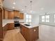 Modern kitchen with a large island, stainless steel appliances, and hardwood floors, providing ample space at 810 Barlow Dr, Knightdale, NC 27545