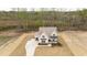 Beautiful home on a large lot, showcasing manicured landscaping and a long, winding driveway at 8624 Dukes Lake Rd, Zebulon, NC 27597