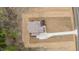 Direct overhead view revealing the home's architectural design, long driveway, and landscaping potential at 8624 Dukes Lake Rd, Zebulon, NC 27597