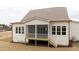 A serene screened-in back porch, perfect for enjoying the outdoors in comfort and style at 8624 Dukes Lake Rd, Zebulon, NC 27597