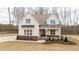 Charming two-story home with a welcoming front porch and meticulously landscaped front yard at 8624 Dukes Lake Rd, Zebulon, NC 27597