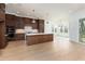 Open-concept kitchen with a large island, and modern stainless steel appliances perfect for gatherings at 8624 Dukes Lake Rd, Zebulon, NC 27597
