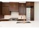 Beautiful kitchen featuring stainless steel appliances, granite countertops, and dark wood cabinetry at 8624 Dukes Lake Rd, Zebulon, NC 27597