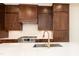 Close-up of a well-appointed kitchen with a large sink, modern faucet, and custom cabinetry at 8624 Dukes Lake Rd, Zebulon, NC 27597